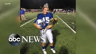 Female high school football player crowned homecoming queen