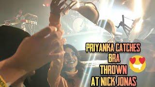 A fan thrown her bra on nick jonas face and suddenly priyanka catches it in mid-air