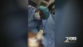 Woman says dancing doctor left her disfigured while making music video during surgery