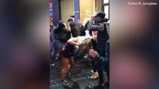 Woman gets her head stamped during brawl outside McDonald's